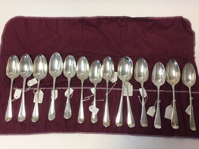 Lot 12 - Collection of 18th century English Hanoverian pattern spoons, various hallmarks, and a later Edwardian pair in the same pattern (14 spoons, 29oz)