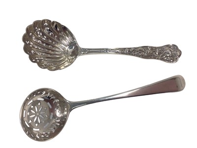 Lot 15 - A rare Bacchanalian pattern silver sifter ladle with fluted bowl, the handle showing Bacchus riding a lion whilst Diana looks on, London 1874 (Lias & Lias), 14cm, together with a Georgian sifter la...