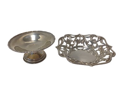 Lot 18 - Two Edwardian silver dishes, including one with scalloped rim and pierced decoration, Birmingham 1908 (Deykin & Harrison), 13cm wide, the other footed with beaded rim, Birmingham 1912, 9.5cm diamet...