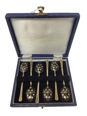 Lot 19 - Cased set of six silver gilt teaspoons decorated with black and white enamelling, Birmingham 1975 (Turner & Simpson)