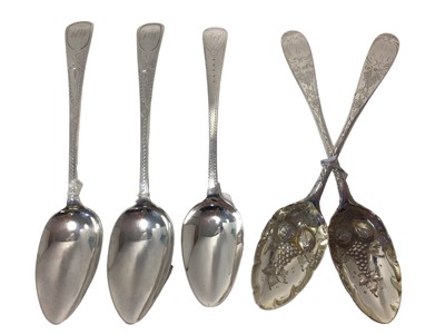 Lot 23 - Group of Georgian silver spoons, including a pair of silver and gilt later-decorated berry spoons, Edinburgh 1789, together with a pair of bright-cut silver spoons, London 1801 (John Lamb) and anot...