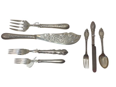 Lot 25 - Pair of Victorian pierced and engraved silver fish servers, a Victorian patterned knife, fork and spoon set, a Victorian serving fork and another Victorian silver fork (7 pieces), the blades and ha...