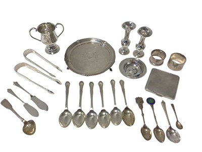 Lot 34 - Group of silver, including two pairs of Georgian sugar tongs, a small salver, a cigarette case, napkin rings, vases, set of teaspoons, etc, 32oz