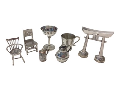 Lot 40 - Group of miniature silver items, including a goblet and mug, two chairs, a jug, a tankard marked .900 and a white metal model of a Japanese torii