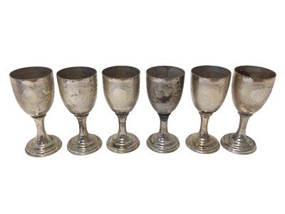 Lot 72 - Set of six Chinese wine cups decorated with dragons, stamped 'Silver' and 'China', 8.5cm high, 9.1oz