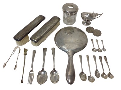 Lot 92 - Edwardian oval pierced silver mustard with blue glass liner, together with a group of flatware, a silver gilt cocktail stirrer, a silver mirror and two brushes, a silver topped pot, and two silver...