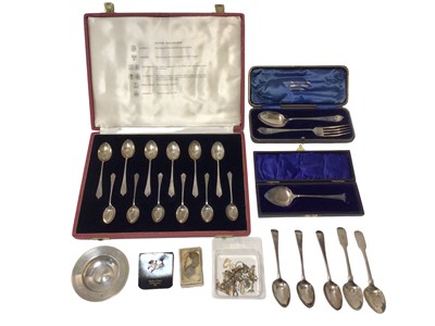 Lot 102 - Group of silver, including a group of Georgian teaspoons, a small dish, a cased fork and spoon set, and a cased set of 12 silver teaspoons, 10.5oz