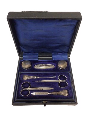 Lot 103 - Cased silver toiletry set, the velvet fitted interior holding scissors, nail file, etc, Birmingham 1938