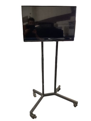 Lot 127 - 32” Samsung TV on display stand and remote controller