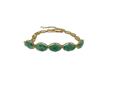 Lot 116 - Chinese gold and jade bracelet set with five oval green jade cabochons