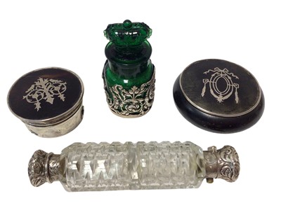 Lot 118 - Silver mounted green glass bottle, Birmingham 1906 (stopper stuck), together with two silver inlaid boxed and a double-ended scent bottle (4)