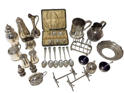 Lot 121 - Large group of silver including Victorian tankard, jug, casters, cream jug, mustards, toast rack, pair of knife rests, pair of salts and spoons with liners