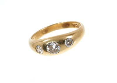 Lot 315 - Early 20th century 18ct gold diamond three stone gypsy ring with three old cut diamonds estimated to weigh approximately 0.90cts in total, in rub-over gold setting, hallmarked Birmingham 1929.