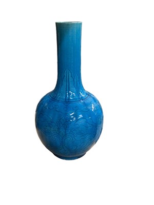 Lot 687 - Chinese/Japanese turquoise glazed bottle vase with incised foliate decoration