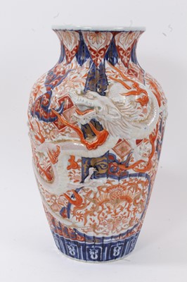 Lot 54 - A large Japanese Imari style vase, Meiji period, of fluted baluster form with applied dragon decoration