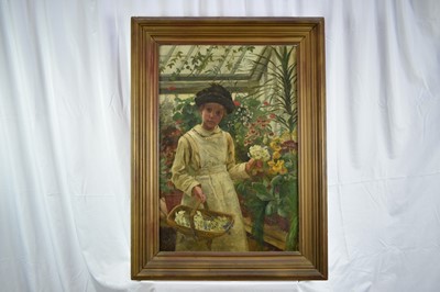 Lot 924 - English School, late Victorian, oil on canvas - portrait of a young girl picking flowers in a conservatory, 76cm x 51cm, framed