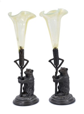 Lot 600 - Pair of Victorian novelty spill vases with yellow vaseline glass trumpets and bear supports