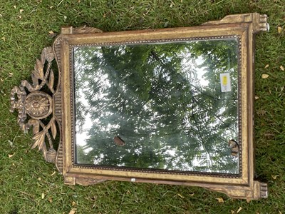 Lot 1264 - 19th century continental gilt wall mirror, with rectangular plate and pieced boss and ribbon tie surmount, 83 x 52cm