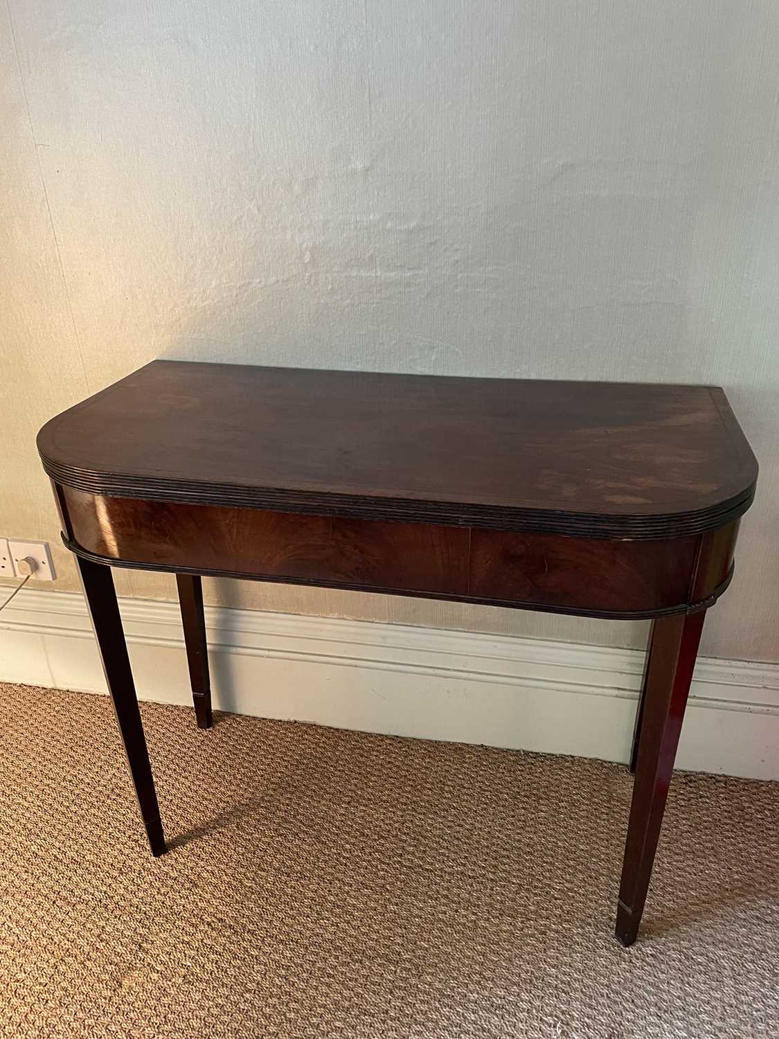 Lot 1258 - Regency mahogany D-shaped card table, with reeded edge on square tapered legs, 81cm wide x 45cm deep x 72cm high