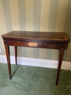 Lot 1291 - Regency mahogany and satinwood crossbanded card table, of canted outline, on square tapered legs and spade feet, 92cm wide x 45cm deep x 75cm high