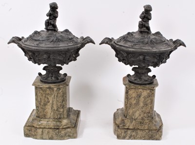 Lot 552 - Pair of late 19th century bronzed lidded urns on faux marble bases