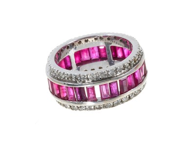 Lot 312 - Ruby and diamond eternity ring in 18ct white gold setting