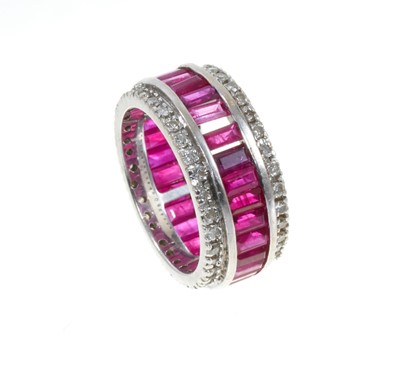 Lot 312 - Ruby and diamond eternity ring in 18ct white gold setting