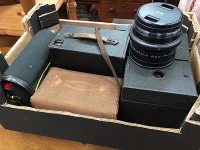 Lot 654 - Box of cameras and lenses, including a Rodenstock lens