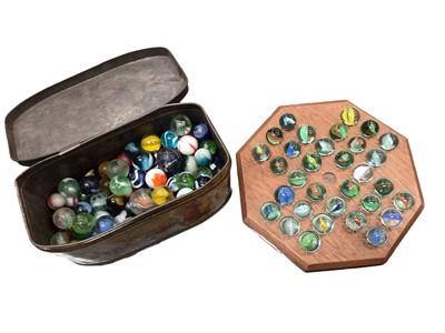 Lot 386 - Collection of vintage marbles and a wooden solitaire board