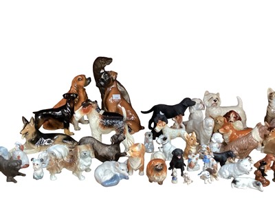 Lot 616 - Collection of various dog ornaments, various manufacturers including Coopercraft and Sylvia's - 1 shelf