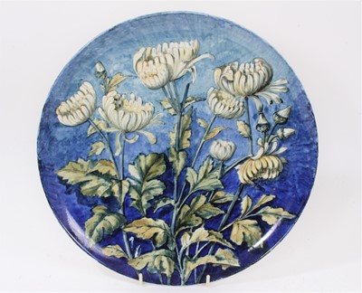 Lot 52 - 19th century pottery dish, painted with flowers on blue background, signed and dated 1882