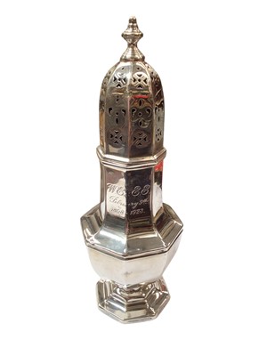 Lot 128 - Silver sugar caster of octagonal form with engraved inscription and weighted base, 18.5cm high