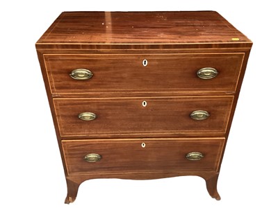 Lot 1253 - A small George III mahogany chest of three drawers with boxwood stringing, oval brass handles on splayed bracket feet