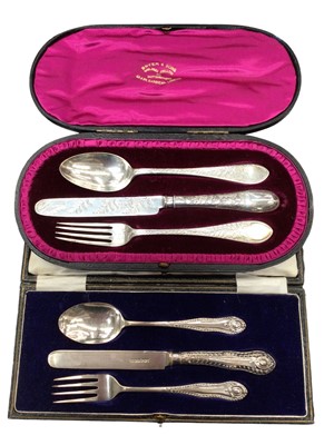 Lot 1073 - Victorian silver three piece christening set in a fitted case, together with another similar (2)