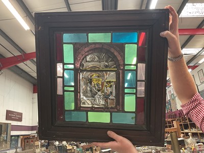 Lot 447 - Stained glass window depicting a religious scene, in a wooden frame.