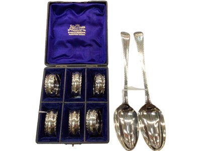 Lot 1050 - Pair of Georgian silver bright cut tablespoons and cased set of six silver napkin rings