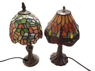 Lot 300 - Four Tiffany style table lamps