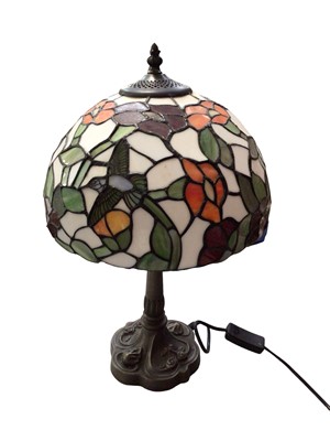 Lot 300 - Four Tiffany style table lamps