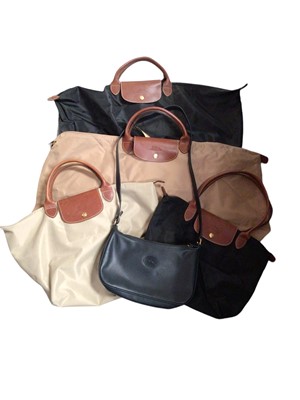 Lot 310 - Longchamp navy leather handbag and four Longchamp canvas tote bags