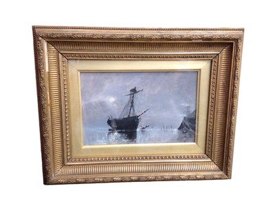 Lot 315 - Oil on board - An old ship ashore low water by moonlight, signed verso, in glazed gilt frame