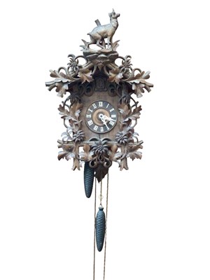 Lot 320 - Black Forest carved cuckoo clock (pendulum and two weighs present)