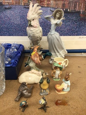 Lot 58 - Group of ceramic ornaments, including a Royal Dux cockatoo, Lladro figure, Beswick, Royal Copenhagen, etc