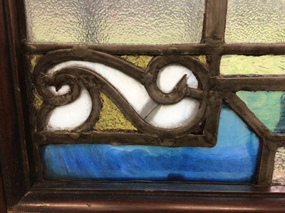 Lot 71 - Pair of Edwardian stained glass panels in mahogany frames together with a pair of leaded glass panels (4)
