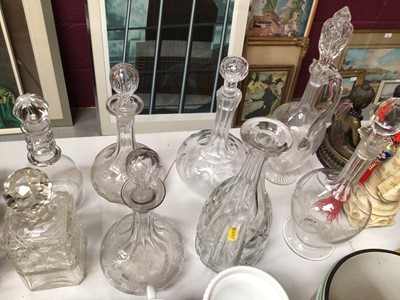 Lot 319 - Eight antique and later cut glass and etched decanters, together with three pottery steins