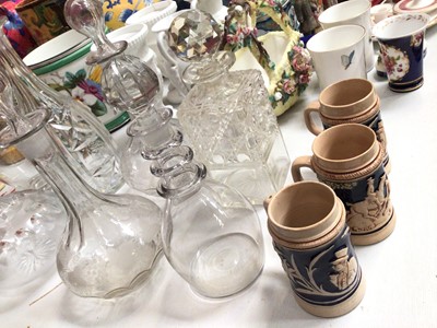 Lot 319 - Eight antique and later cut glass and etched decanters, together with three pottery steins