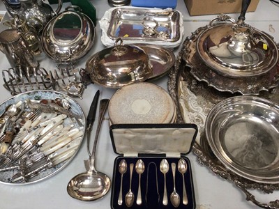 Lot 329 - Silver plated ware including tureens, tea and coffee pots, toast racks, mother of pearl handled cake forks, other flat ware, a salver and a large two handled tray