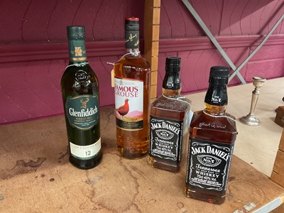 Lot 421 - Four bottles of Whisky The Famous Grouse, 1litre, Glenfiddich, 70cl and two bottles of Jack Daniels 70cl (4 bottles).