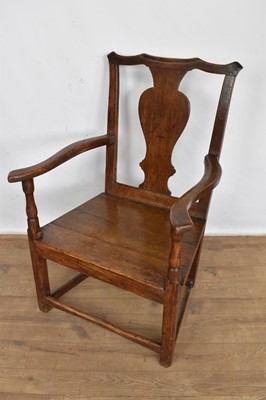 Lot 1232 - George II oak and elm country open armchair