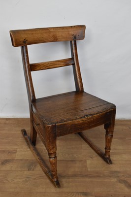 Lot 1233 - 19th century primitive child’s elm rocking chair