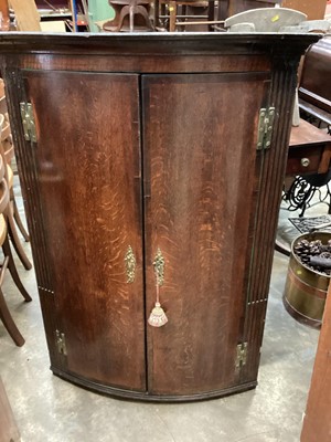 Lot 1303 - George III bow front hanging corner cupboard